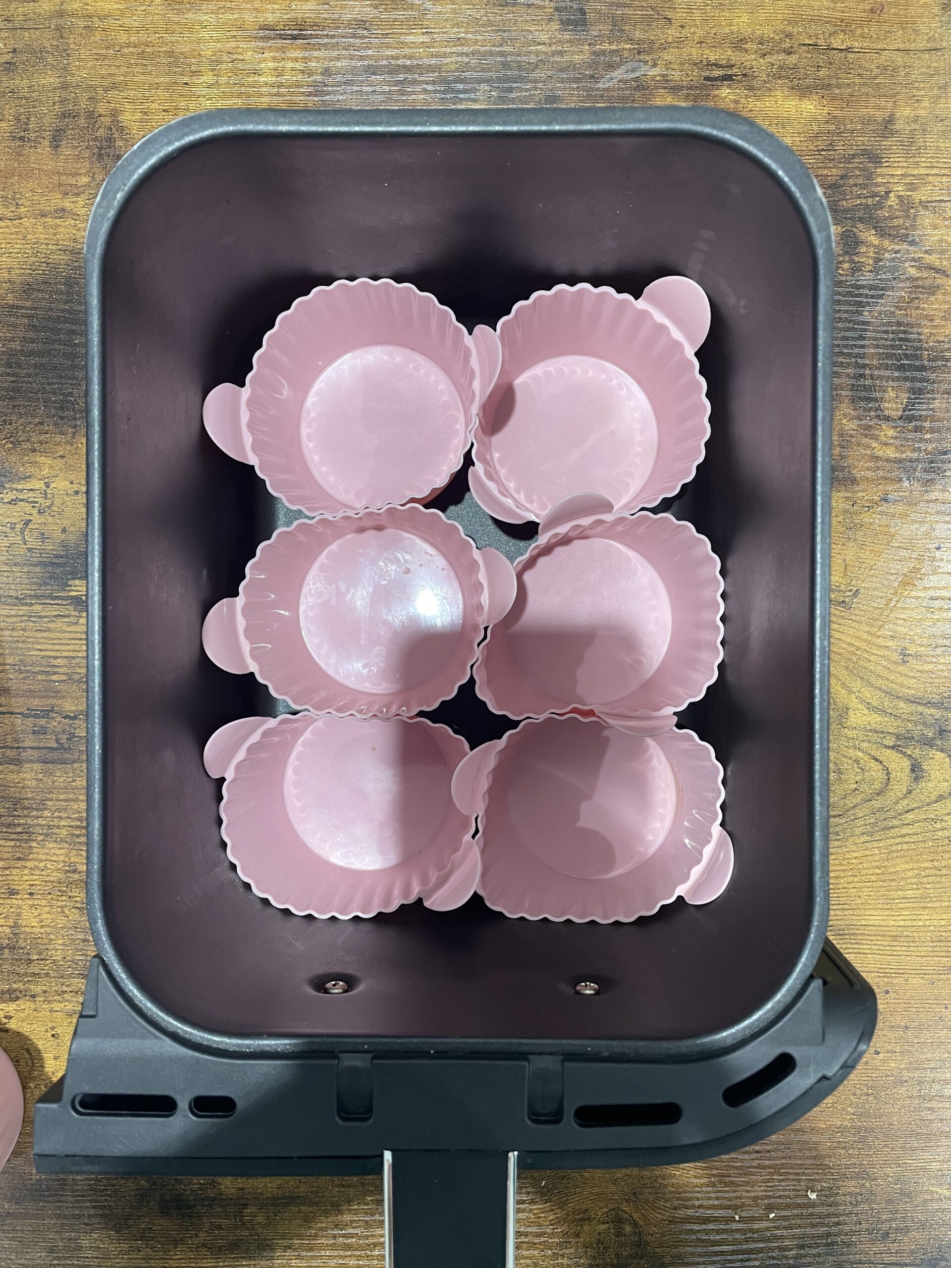 silicone muffin cases in the drawer of ninja foodi max air fryer