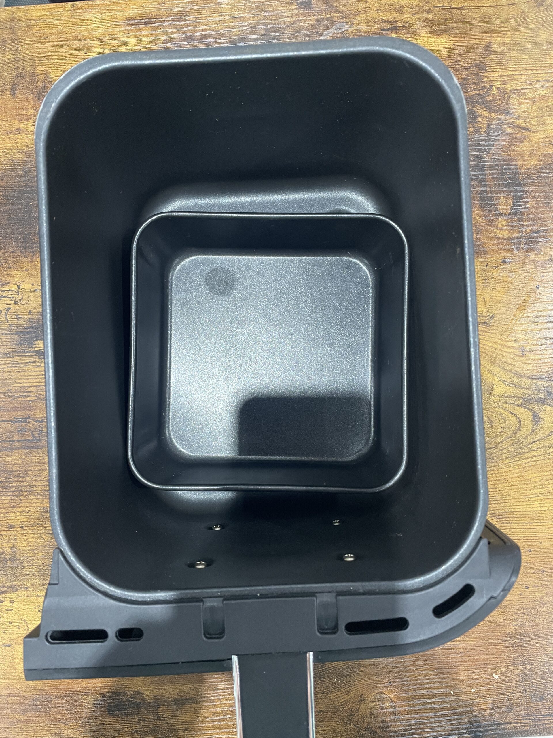 square tin in the drawer of the ninja foodi max air fryer